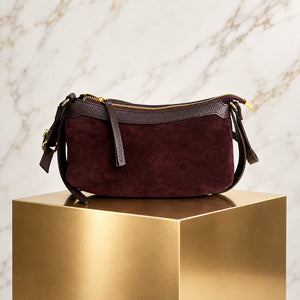 THE ARC SUEDE CROSSBODY BAG , BORDEAUX